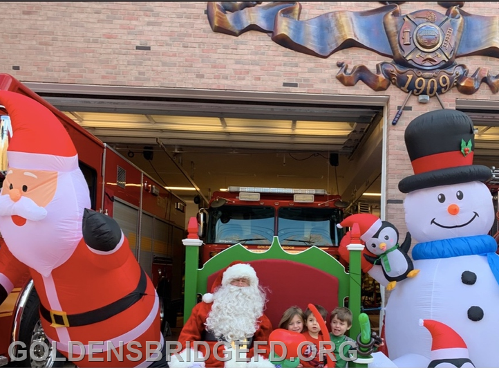 Children got to try out Santa's special bench, said to be from the North Pole, at the curbside children's holiday event at the Golden's Bridge Firehouse. (Golden's Bridge Fire Department )