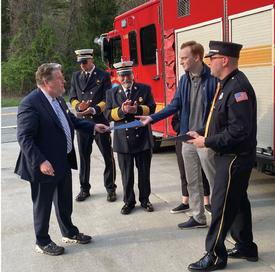Ryan Baker accepts the State Senate proclamation from Sen. Peter Harckham that acknowledges the lifetime of public service of his late father, Golden’s Bridge Deputy Fire Chief Raymond J. Baker, Sr., who died unexpectedly in March