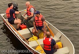 GBFD firefighters aboard Marine 25 review safety operations.